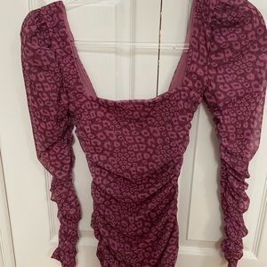 Oh Polly leopard print long sleeve mini dress.